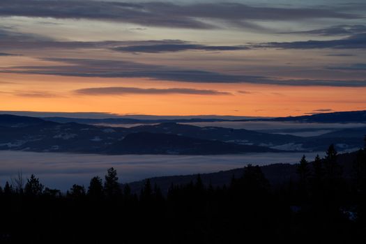 Breathtaking winter sunset landscape in Noresund, Norway, showcasing serene beauty.