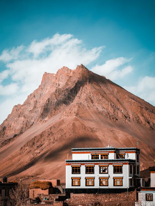 Free Amazing view of a snow-capped mountain and traditional monastery in Spiti Valley. Stock Photo