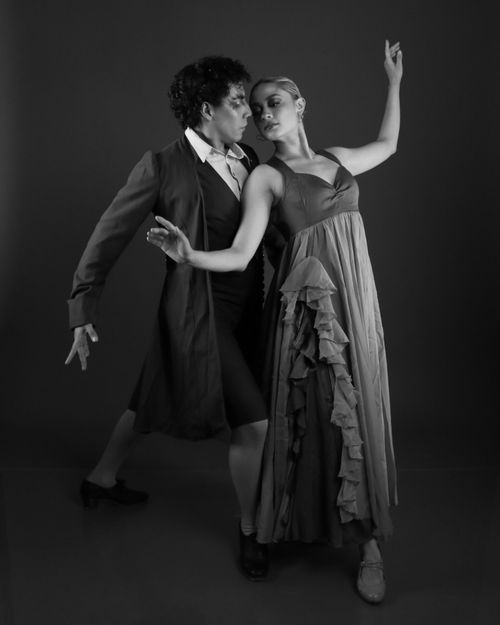 Free Black and white photo of two dancers in fluid motion, highlighting grace and elegance. Stock Photo