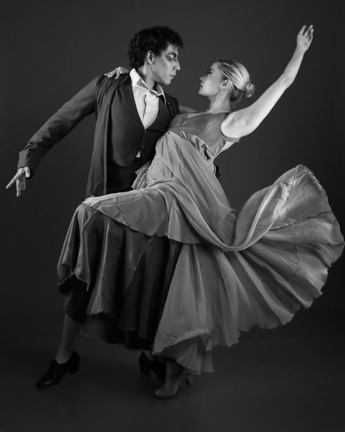 Free A graceful dance performance captured in dynamic motion in classic black and white. Stock Photo