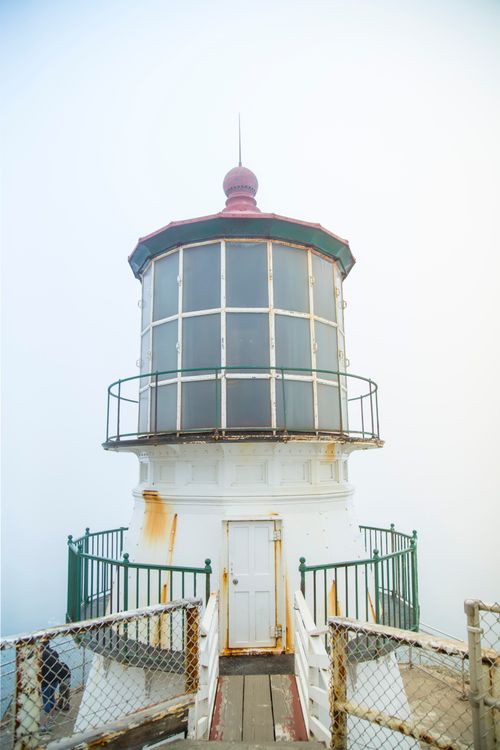 Free Vintage lighthouse at Point Reyes offers a misty and scenic view, ideal for coastal photography. Stock Photo