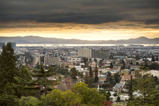 Stunning cityscape of Oakland, California at sunset with dramatic cloud coverage and scenic views.