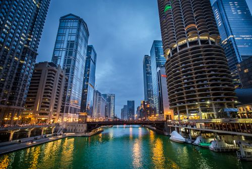 Free Scenic view of Chicago's downtown skyline over the river at twilight. Stock Photo