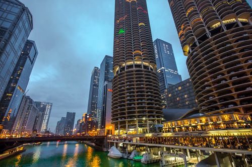 Free View of Chicago's Marina Towers and skyline under a vibrant twilight glow. Stock Photo