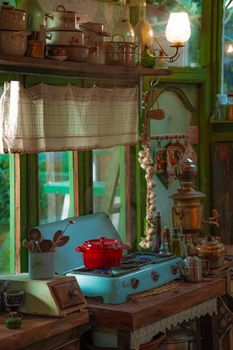 Charming vintage kitchen with rustic cookware and cozy atmosphere.
