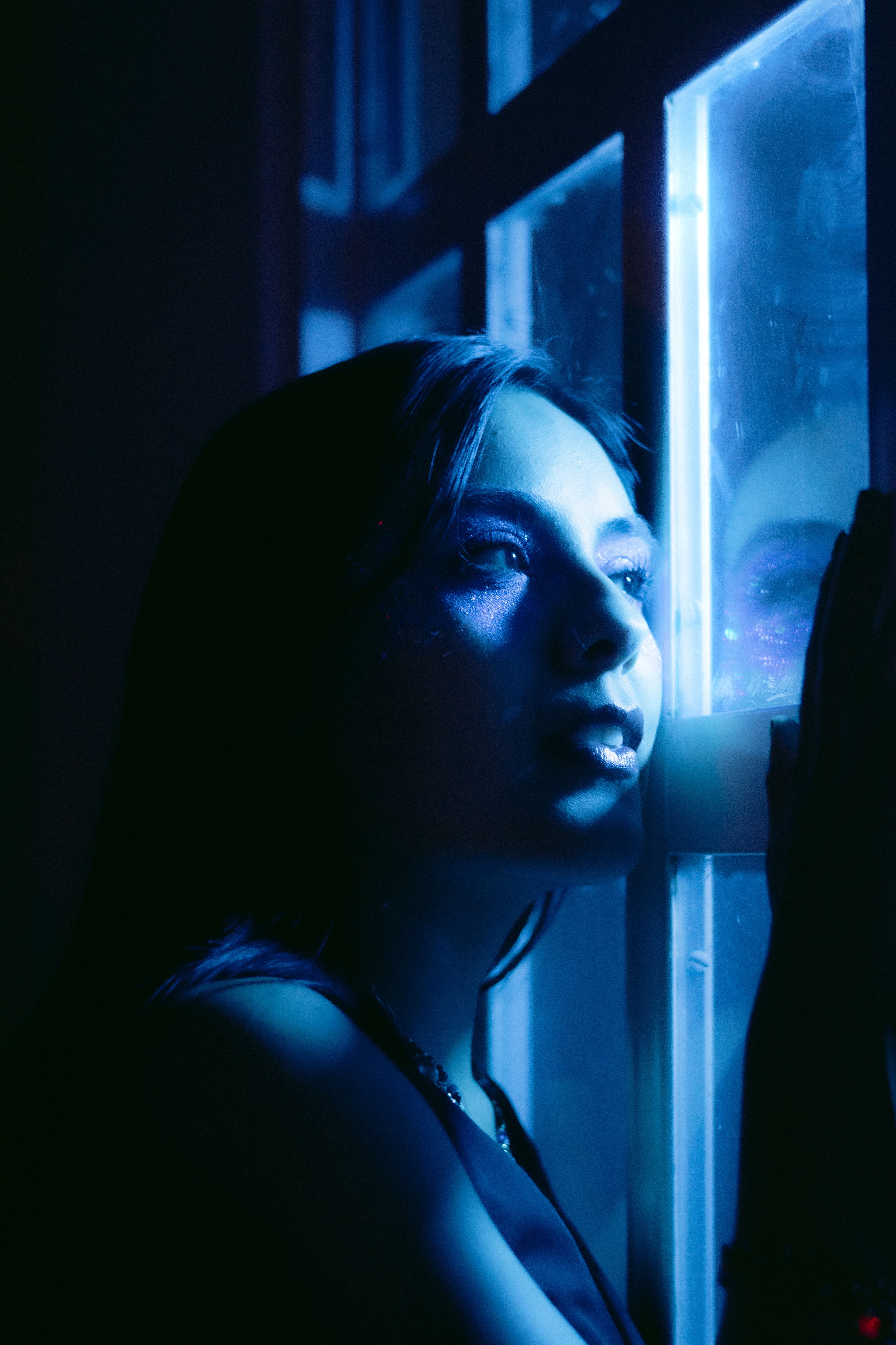 Moody Portrait of Woman in Blue Light · Free Stock Photo