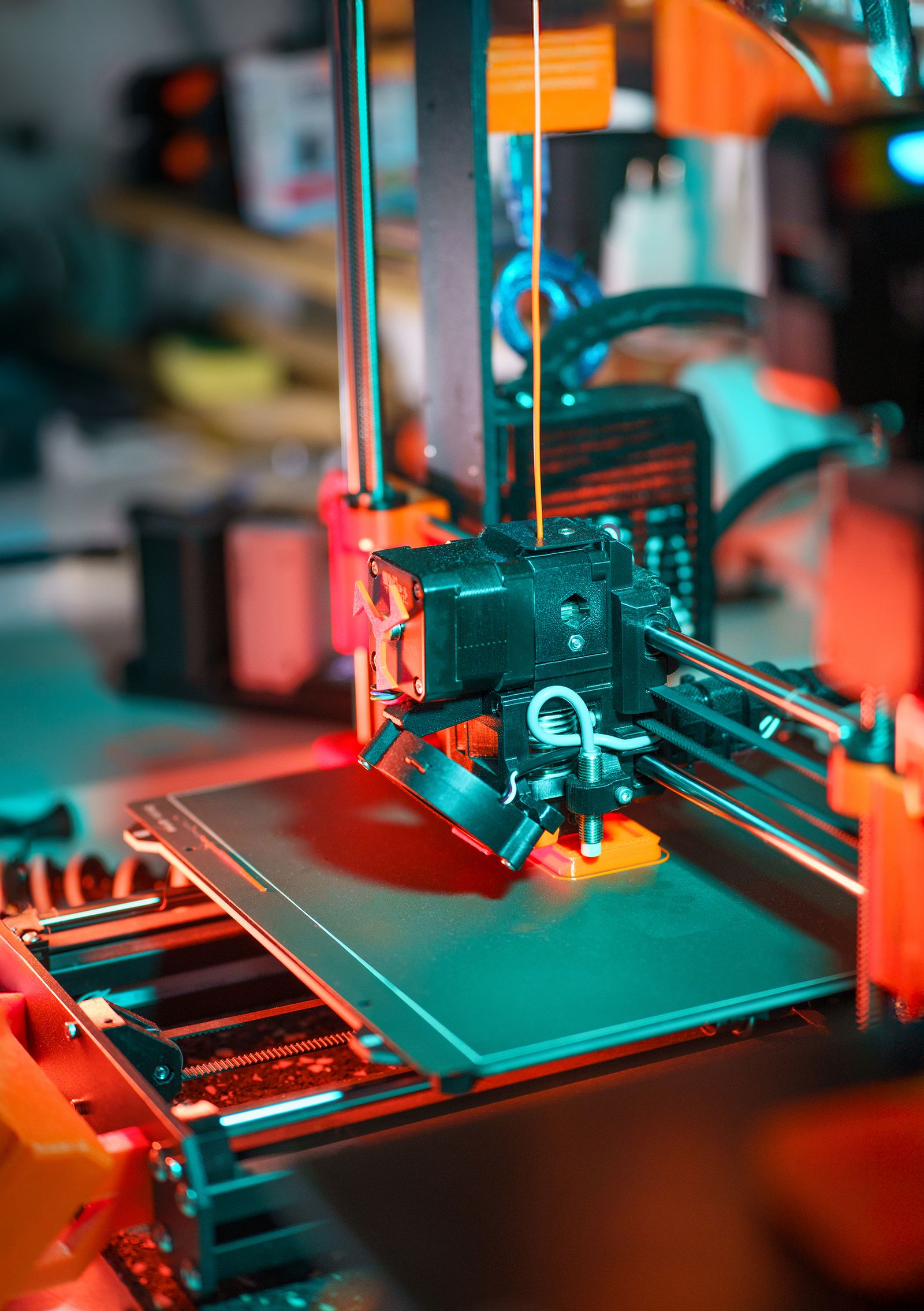 3D printer creating a prototype model in a workshop