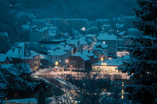Free Aerial view of snowy Lilienfeld at night, highlighting Austrian architecture. Stock Photo