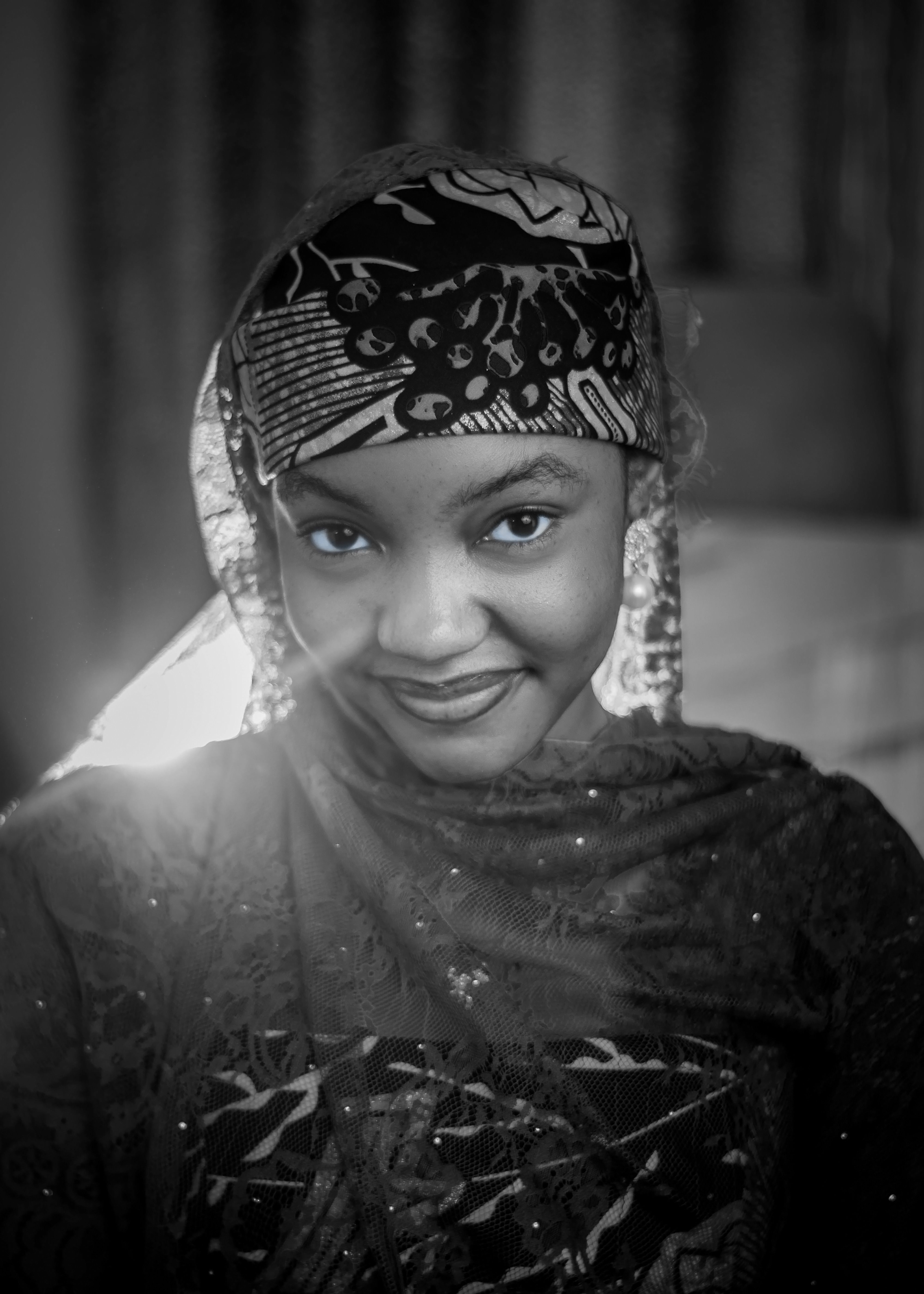 Elegant Portrait of a Smiling Woman in Headscarf · Free Stock Photo
