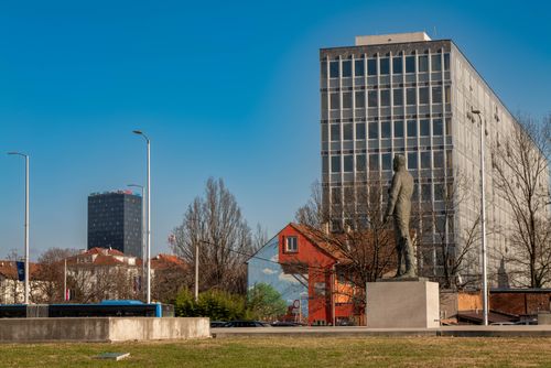 Free A statue beside modern architecture in downtown Zagreb, Croatia on a clear day. Stock Photo
