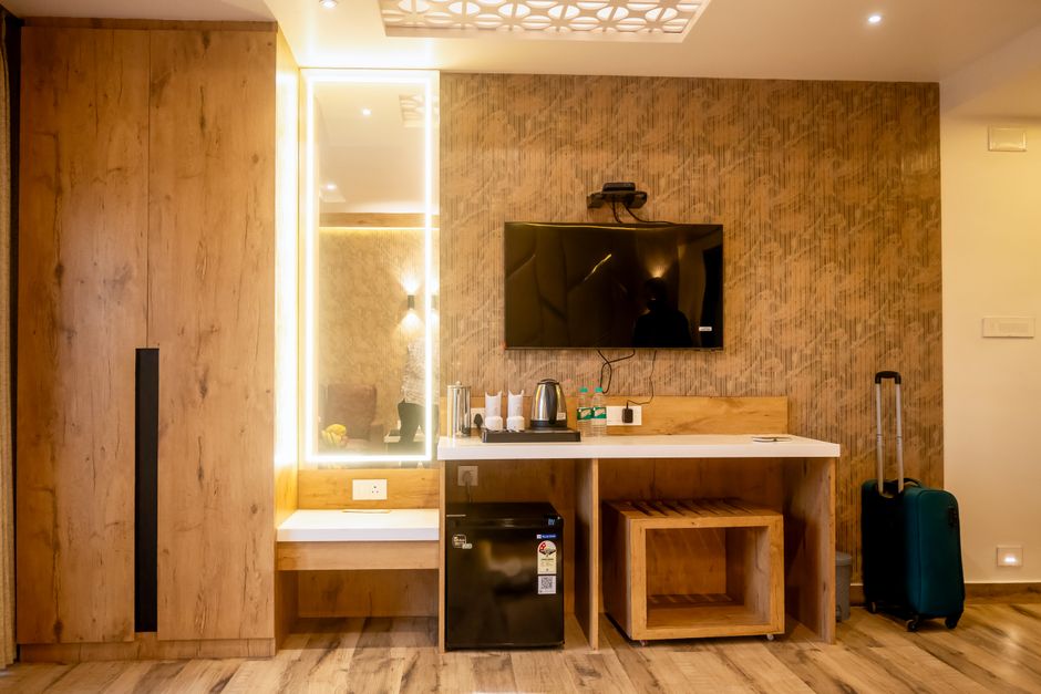 Elegantly designed hotel room with modern amenities and minimalist decor.
