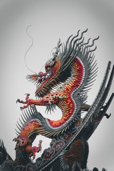 Detailed dragon sculpture with vibrant colors, showcasing traditional craftsmanship and culture.