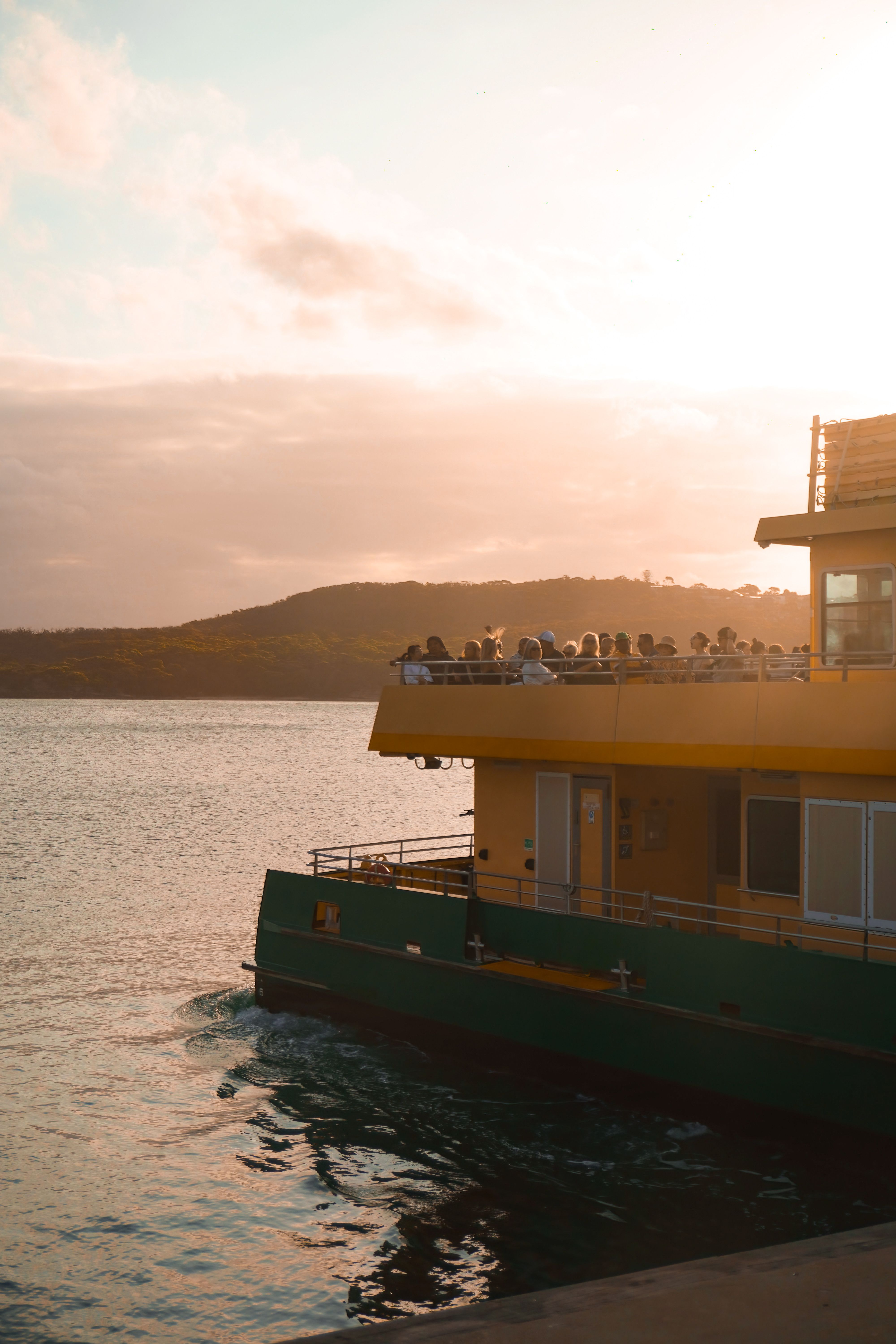 Ferry with Passengers During Scenic Sunset Voyage · Free Stock Photo