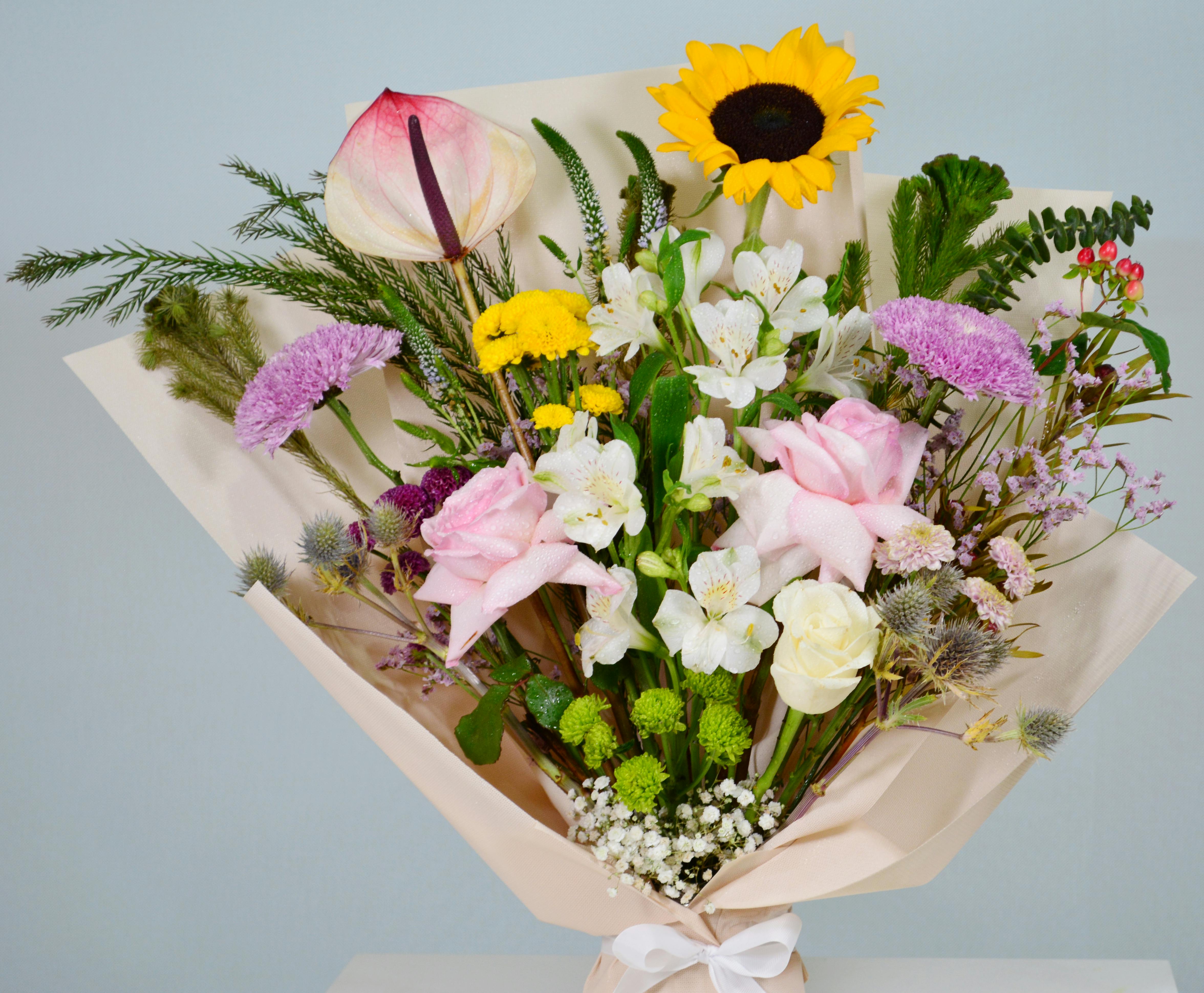 Mixed Flower wrapped in Paper Bouquet