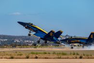 Blue and Yellow Jet Plane on the Field