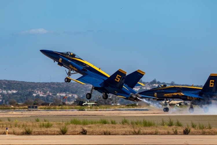 Blue And Yellow Jet Plane On The Field