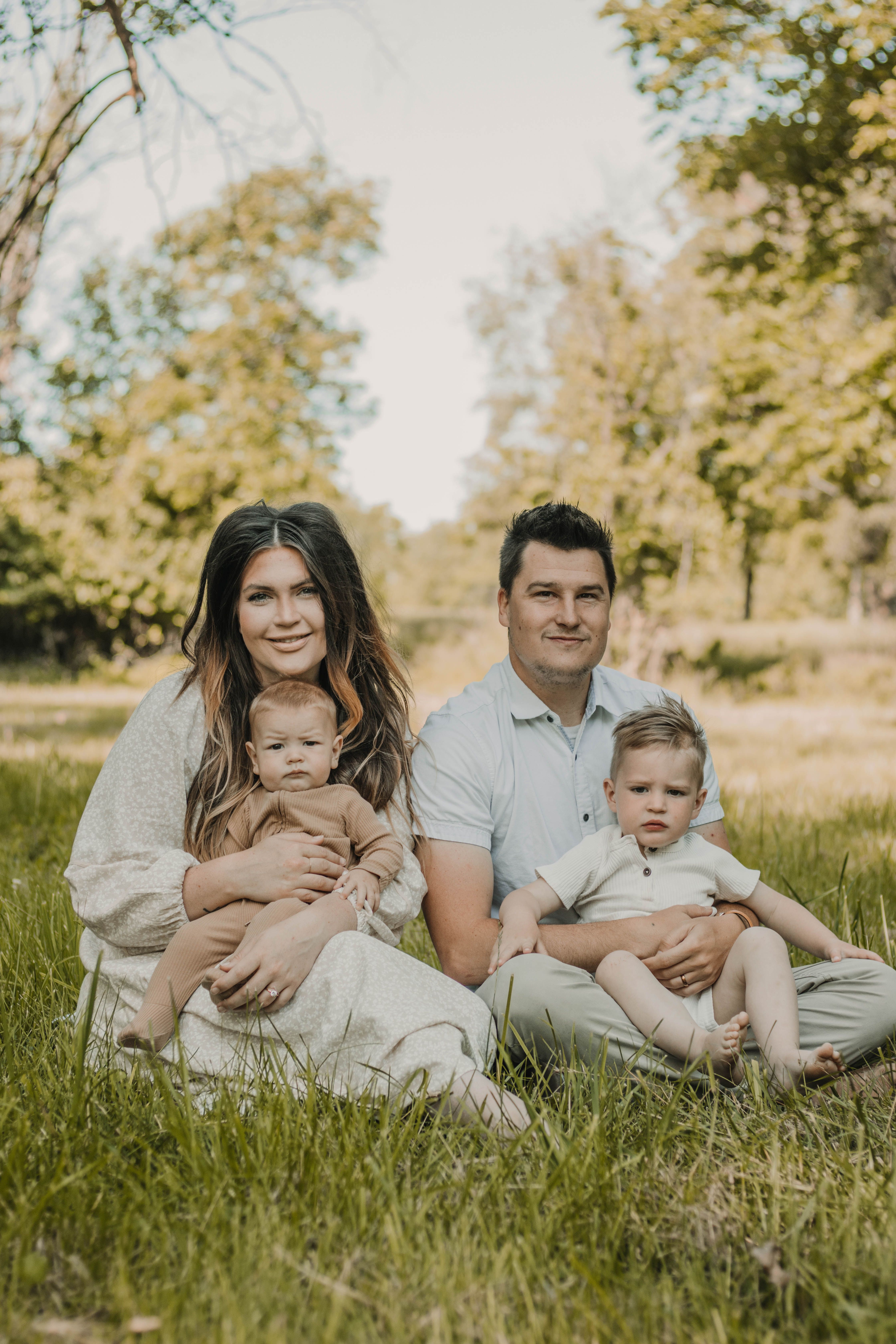 Heartwarming Outdoor Family Portrait in Nature · Free Stock Photo