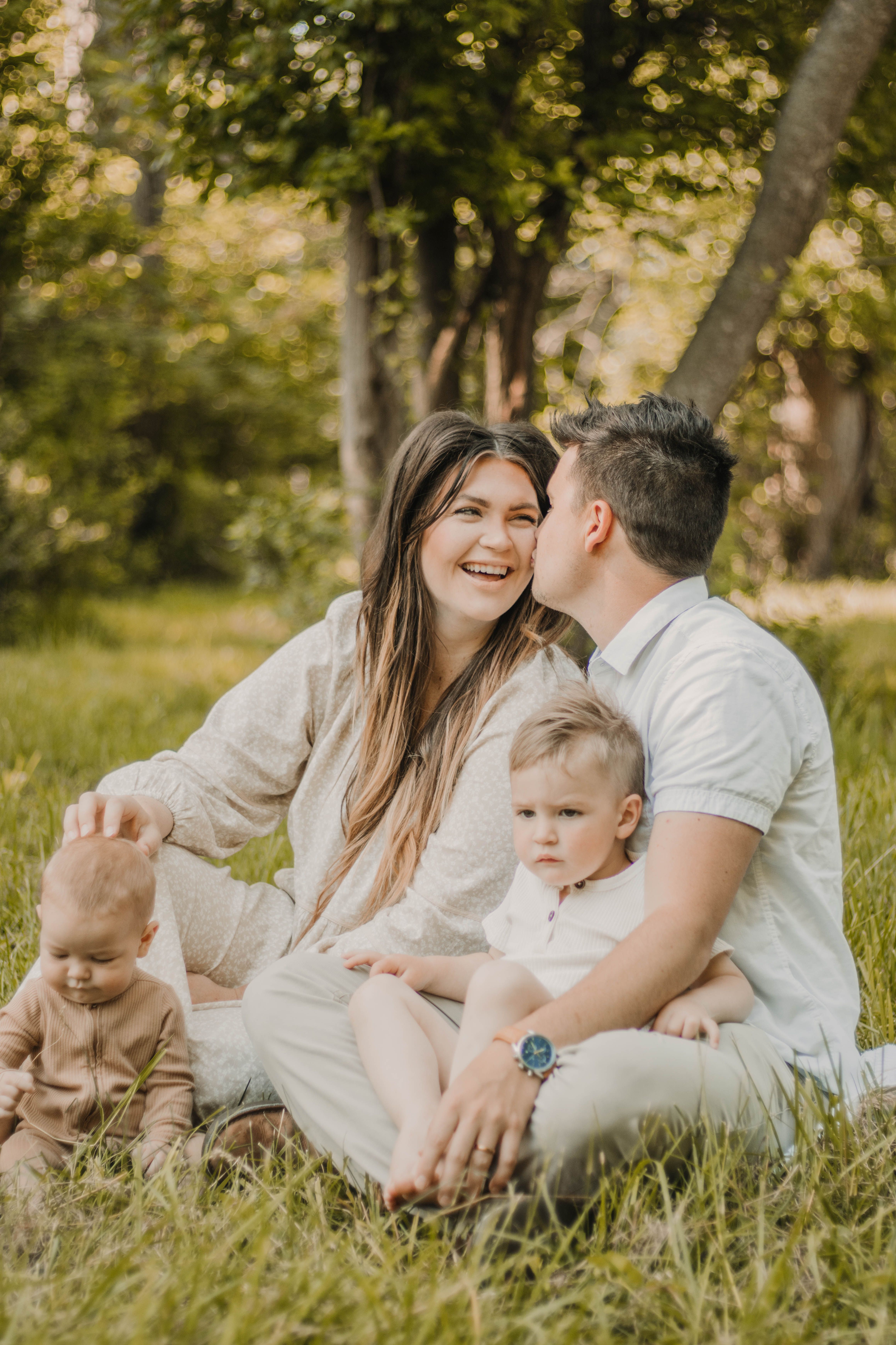 Warm Family Bonding in a Serene Woodland Setting · Free Stock Photo