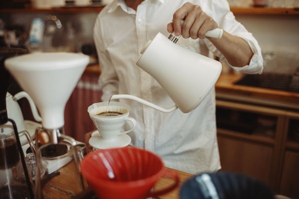 Barista pouring coffee