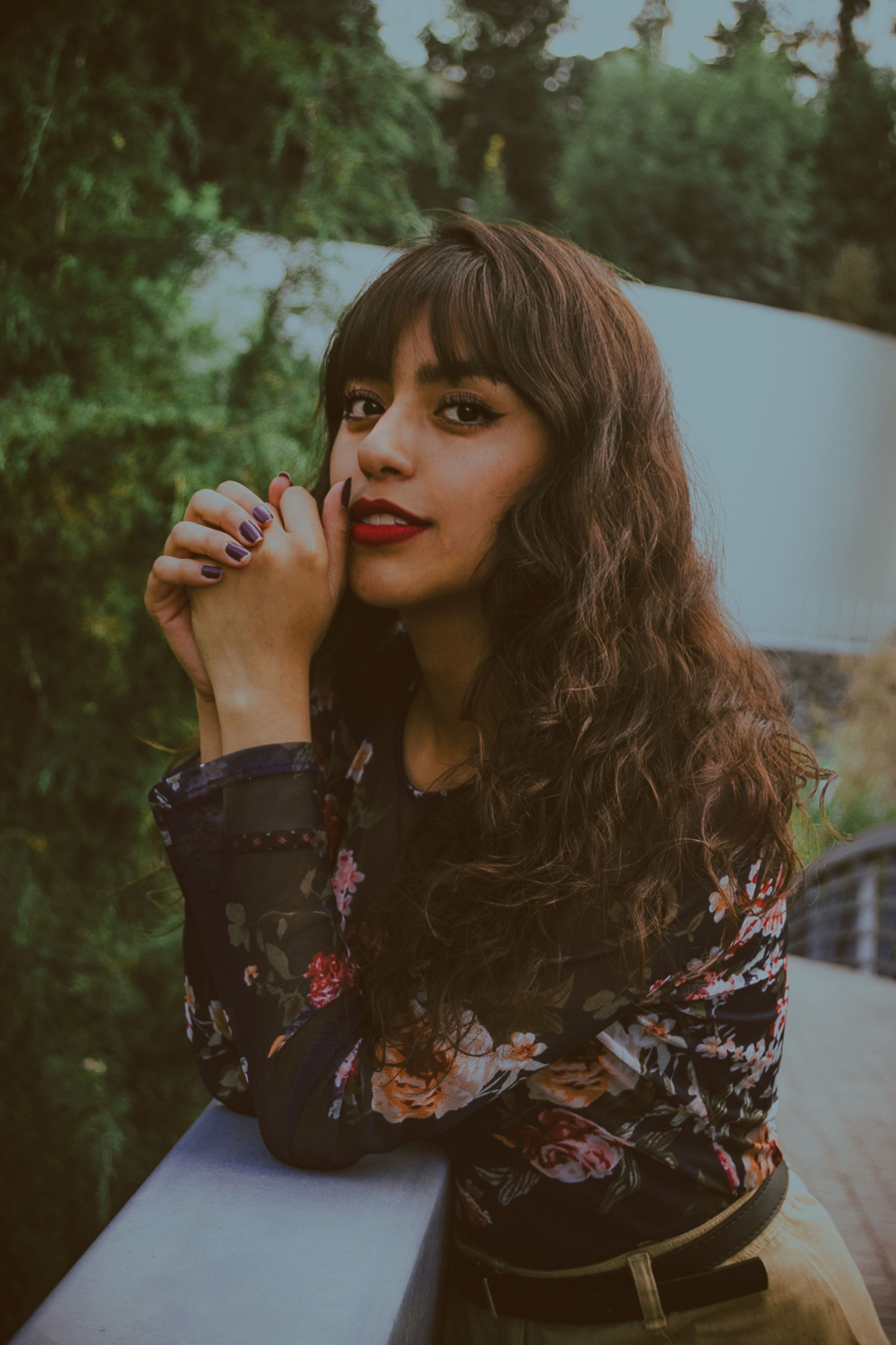 Portrait of Woman in Floral Top Outdoors · Free Stock Photo