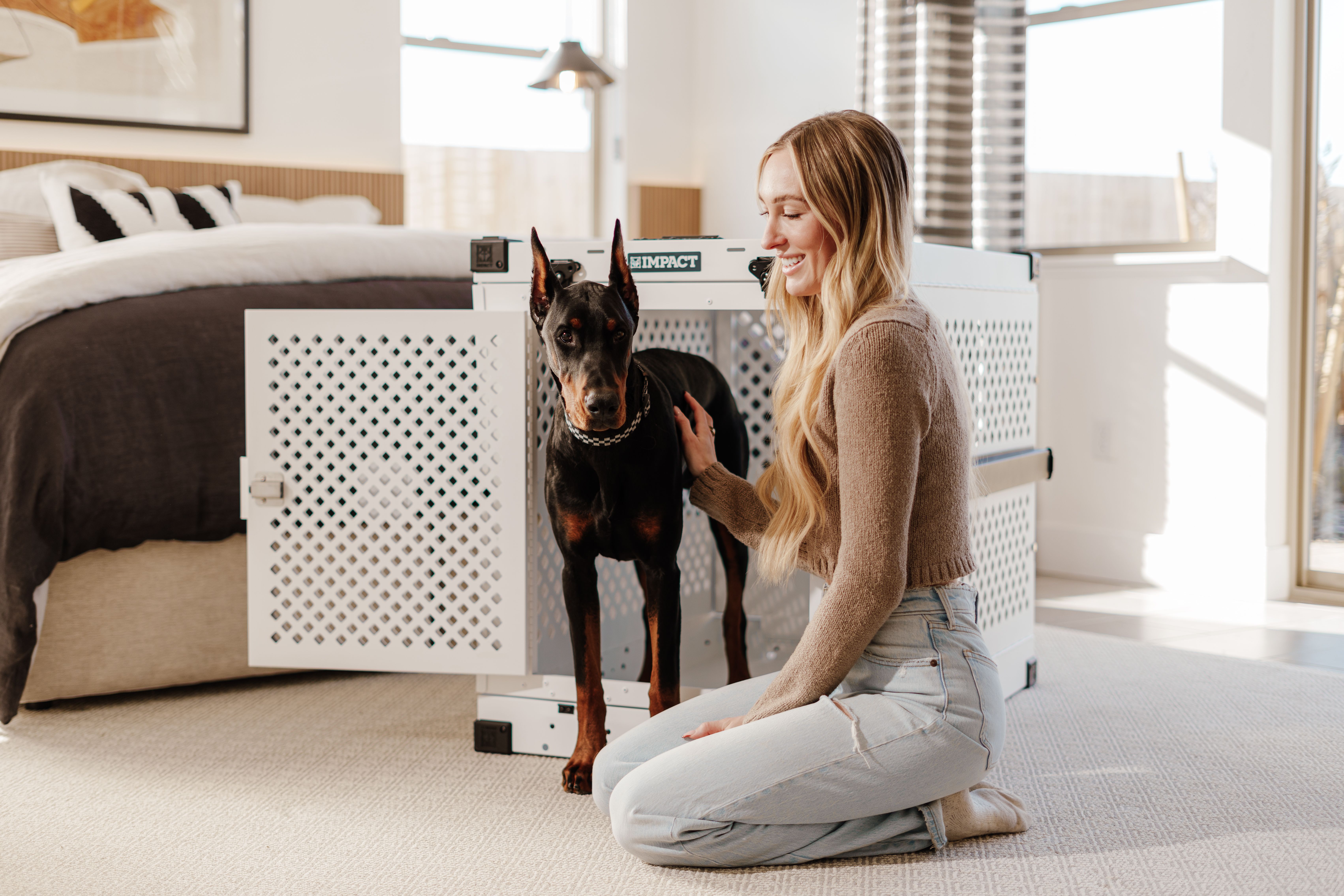 https://www.pexels.com/photo/young-woman-with-doberman-in-stylish-bedroom-30268685/