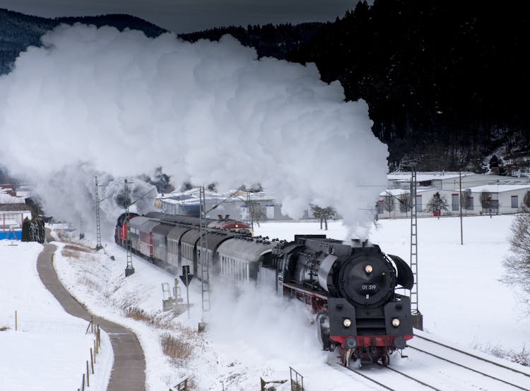 Train Traveling On Snow