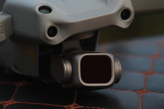 Detailed view of a drone camera lens, showcasing technology.