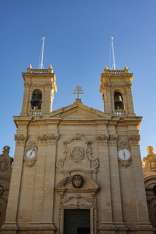 Free The iconic facade of St. John's Co-Cathedral in Valletta, Malta under a clear blue sky. Stock Photo