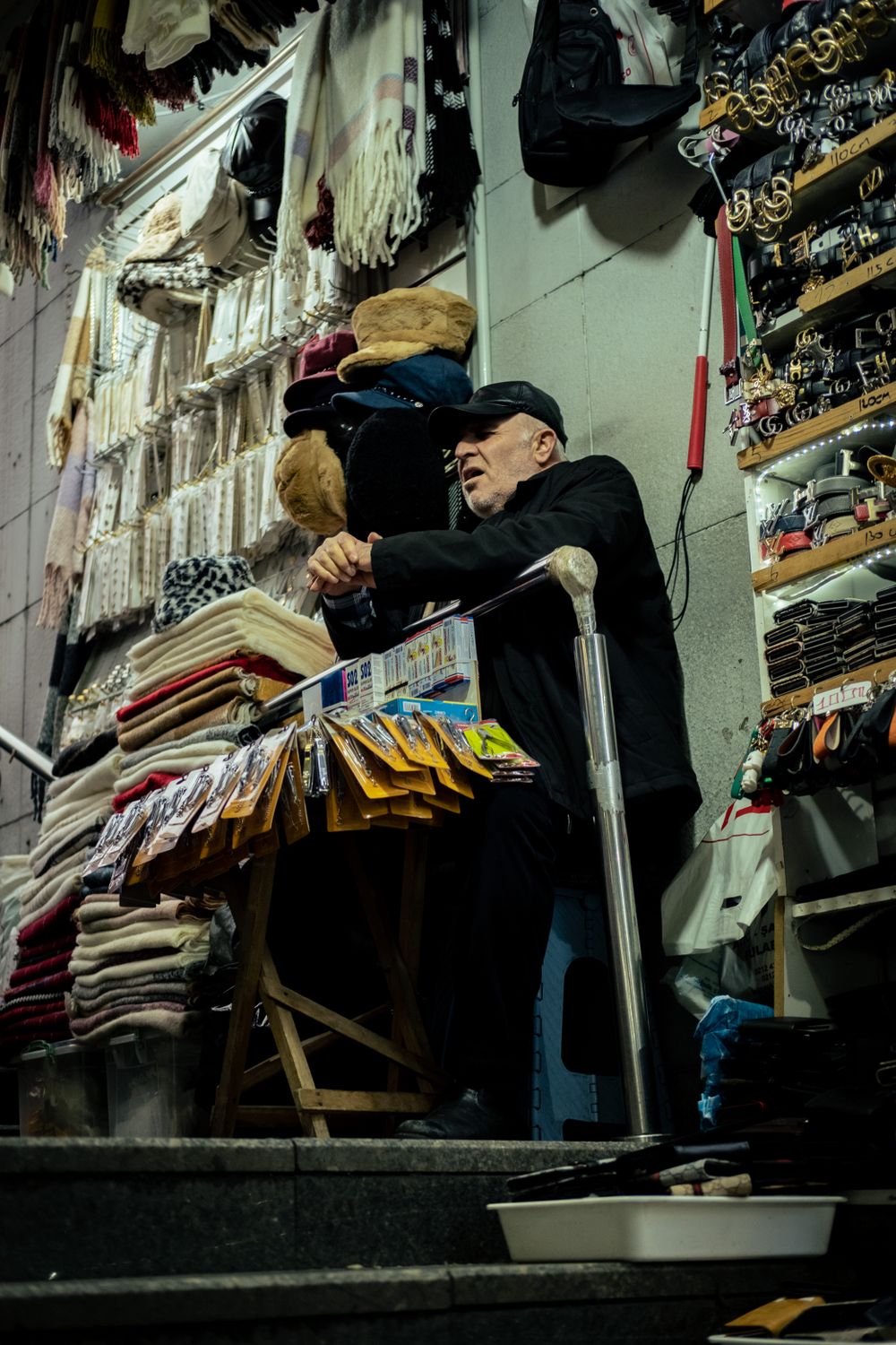 Street Vendor in a Cozy Indoor Bazaar Setting · Free Stock Photo