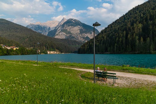 Tranquil scene of lake and mountains in Veneto, Italy during summer.
