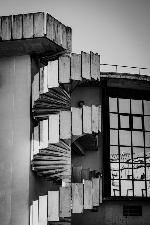 Free Architectural detail of a brutalist spiral staircase in black and white. Stock Photo