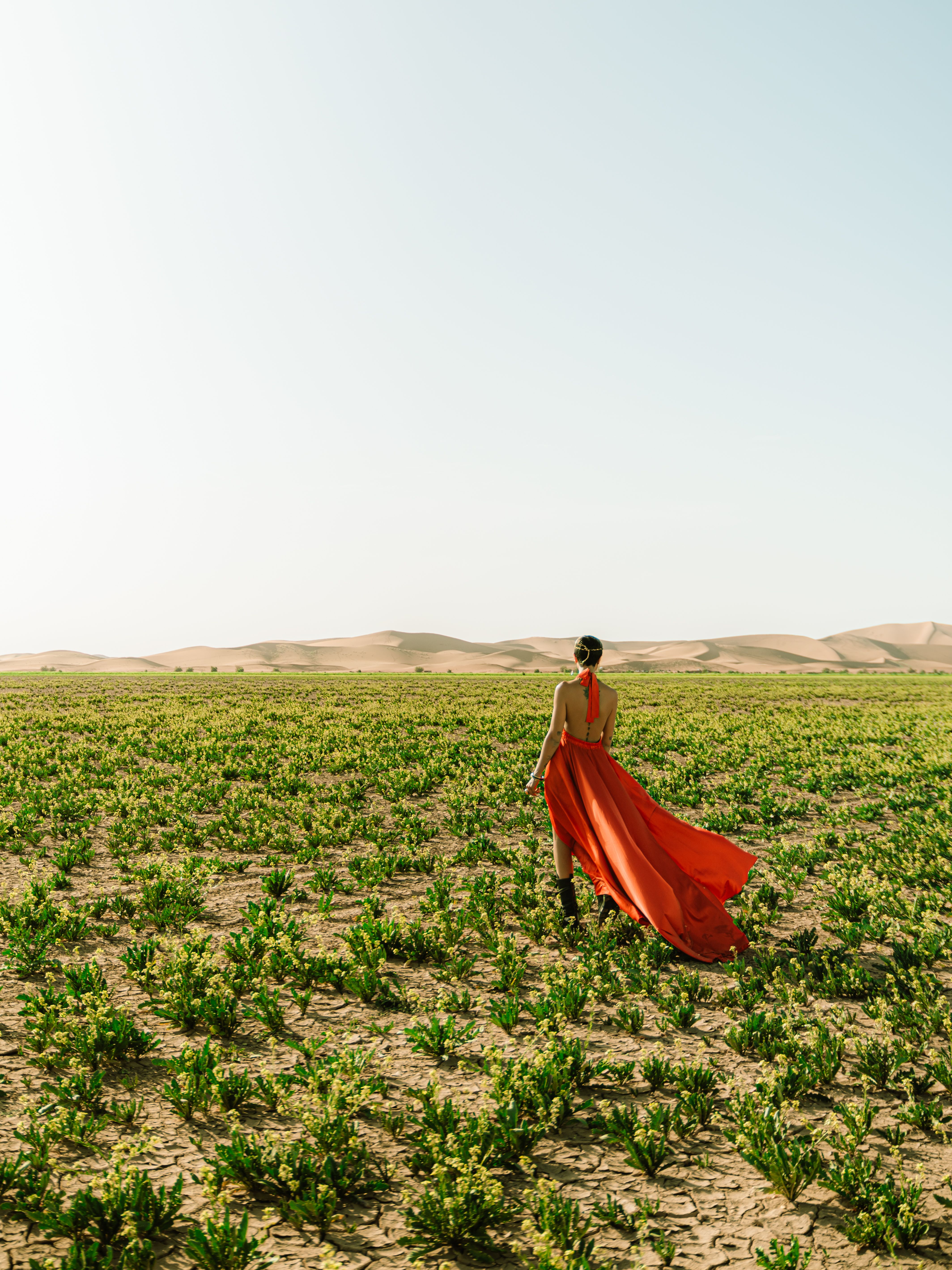 Woman in Red Dress Walking in Moroccan Desert · Free Stock Photo