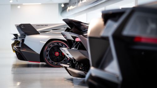 Free Close-up of elegant supercars in a contemporary indoor showroom. Stock Photo