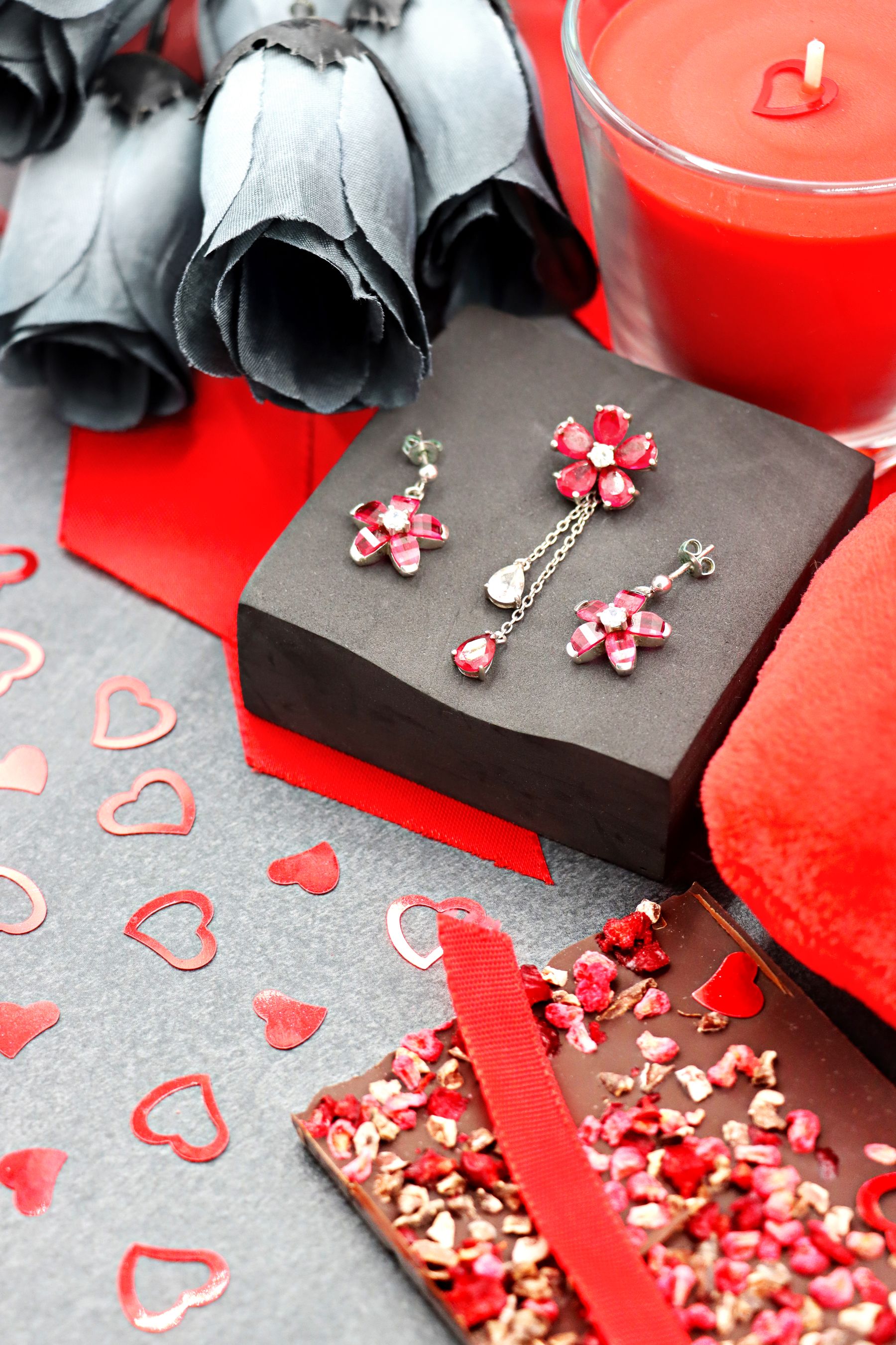 Dark-toned romantic decor vignette with strong contrast