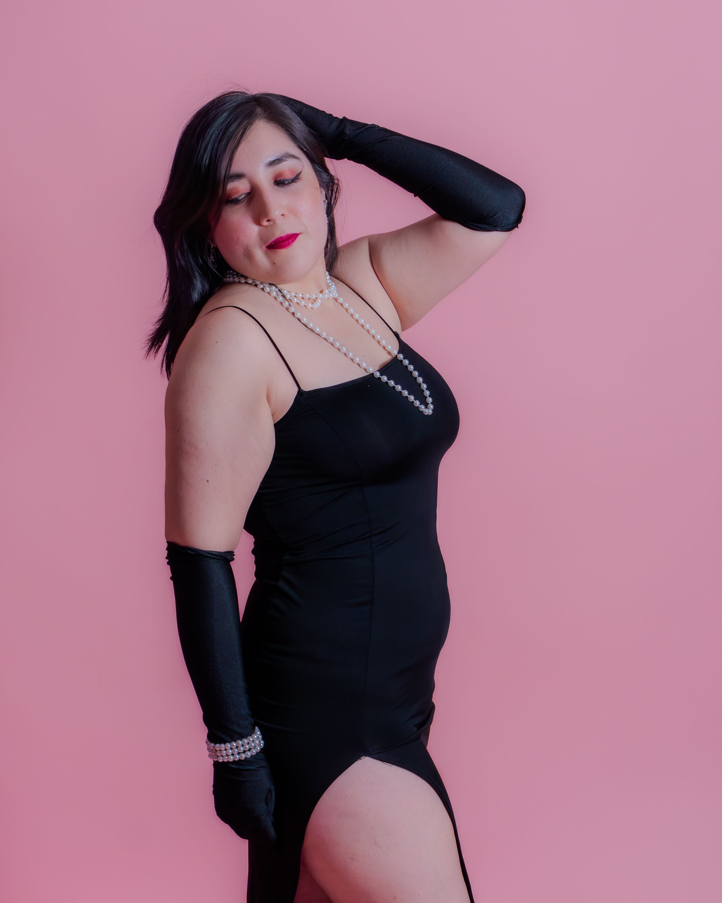 Elegant Woman Posing in Black Dress · Free Stock Photo