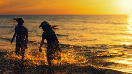 Children Running on Seashore