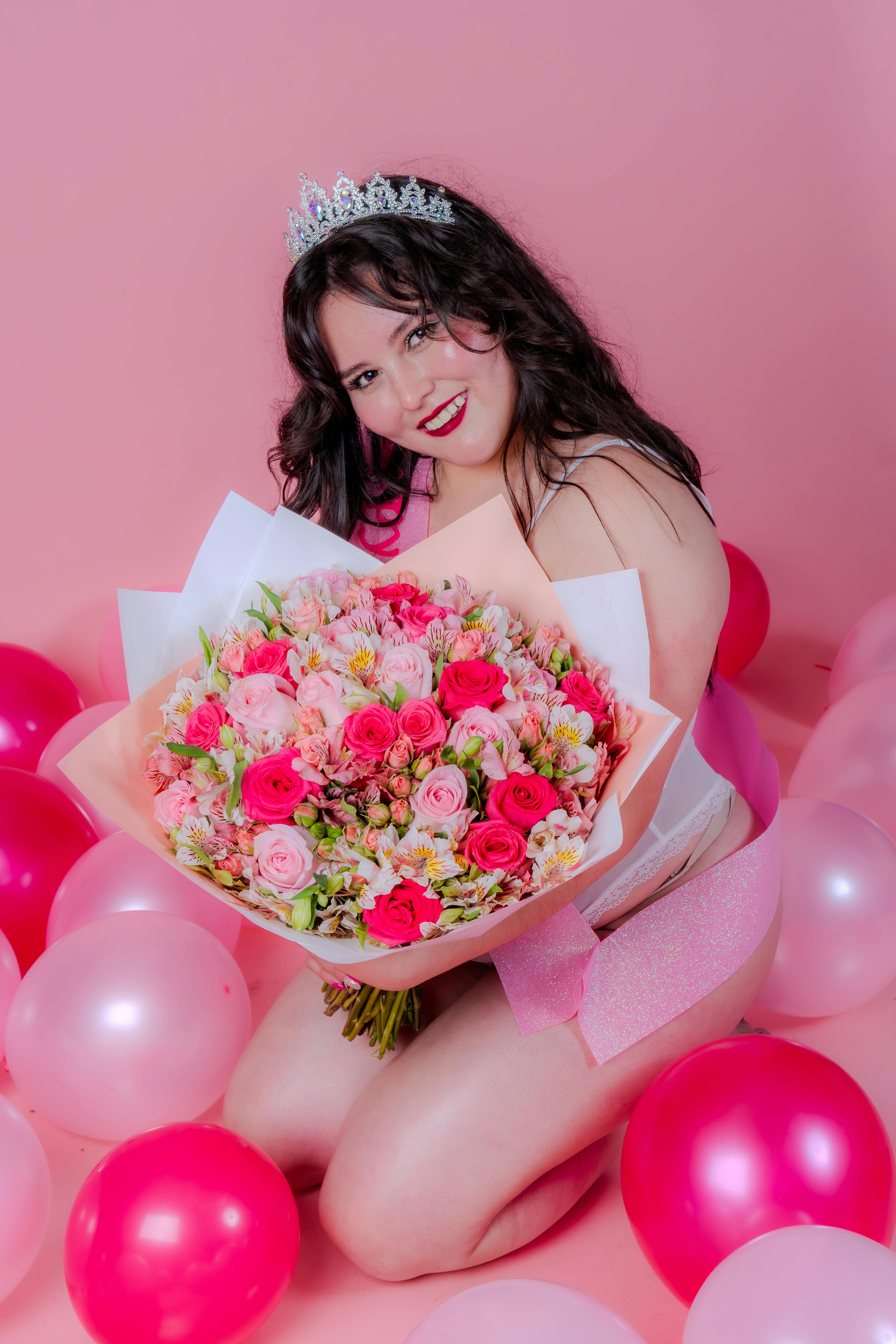 charming woman with flowers and balloons celebration