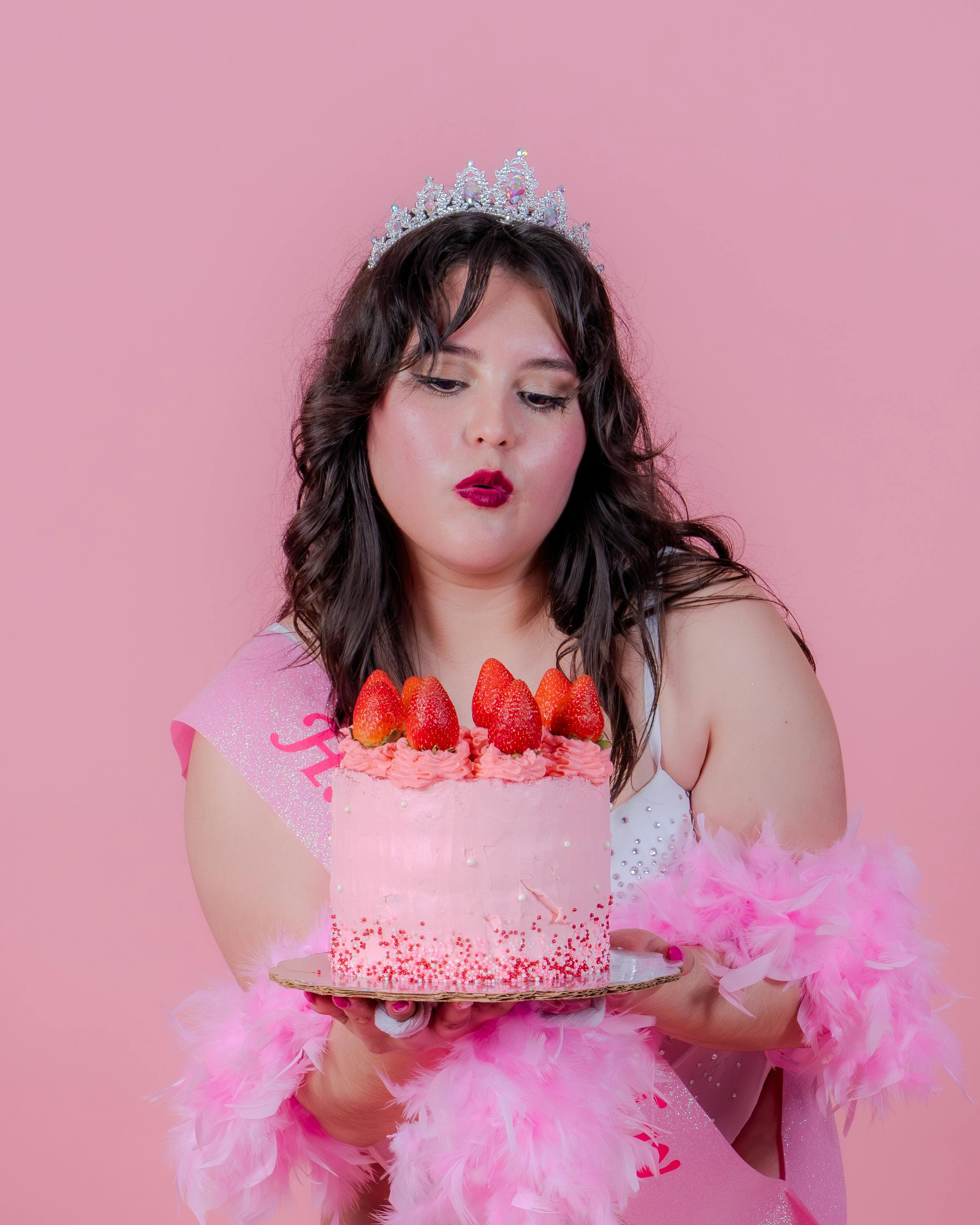 birthday celebration with pink strawberry cake