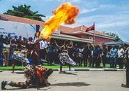 Vibrant fire dance showcasing Angolan culture in Luanda city celebration.