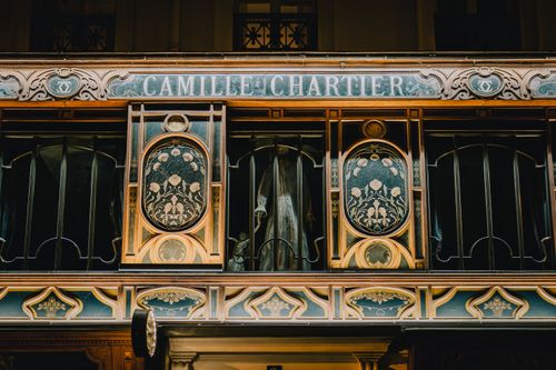 Free Beautiful Art Nouveau facade of Camille Chartier restaurant in Paris. Captures intricate architectural details. Stock Photo