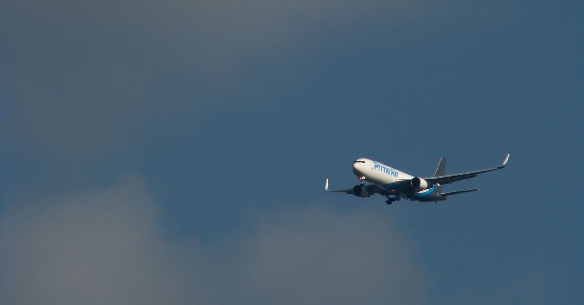 Photo by Fernando da Silva A commercial airplane mid-flight against a blue sky filled with clouds.