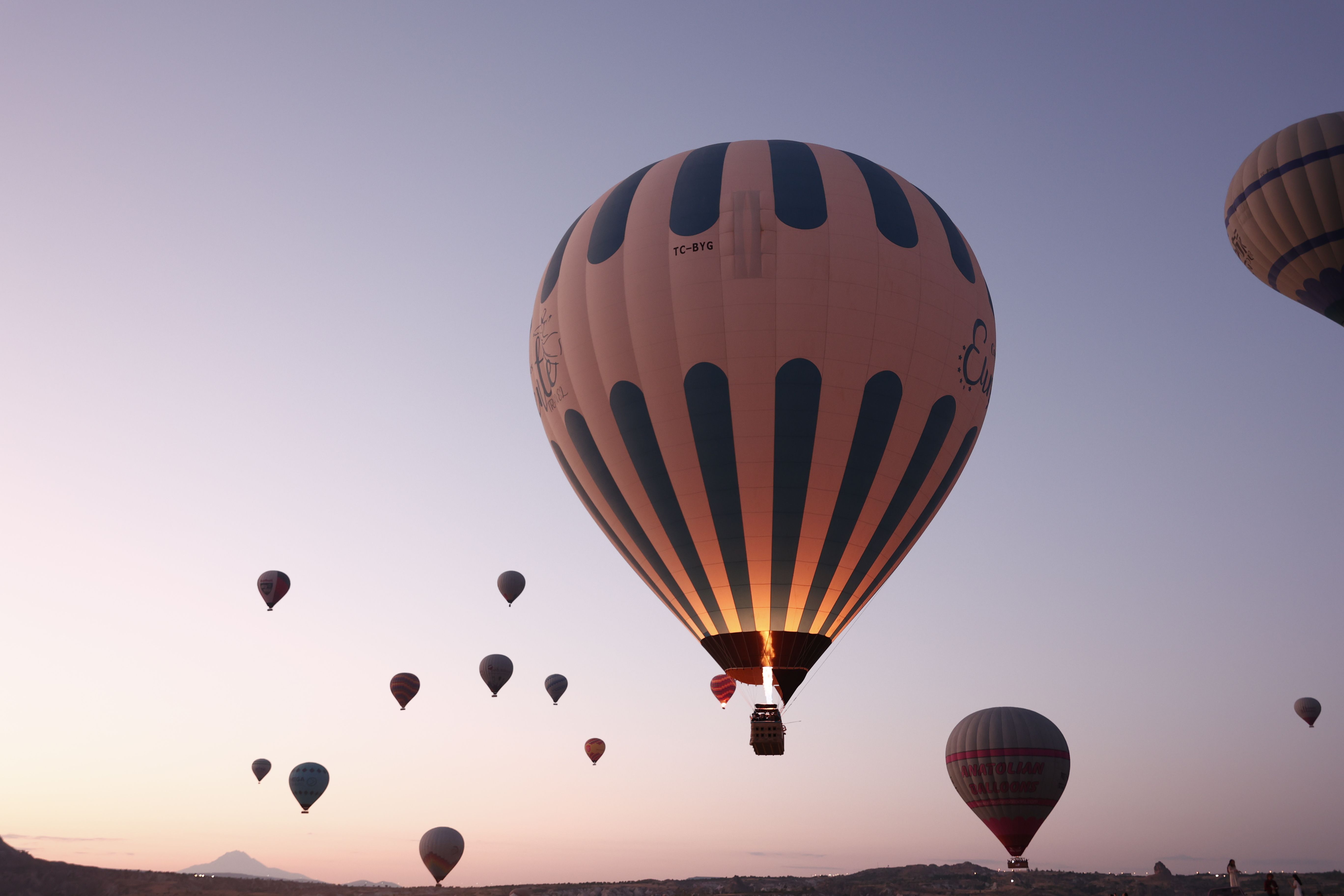 Sunrise balloons over the West Bank in cool winter light