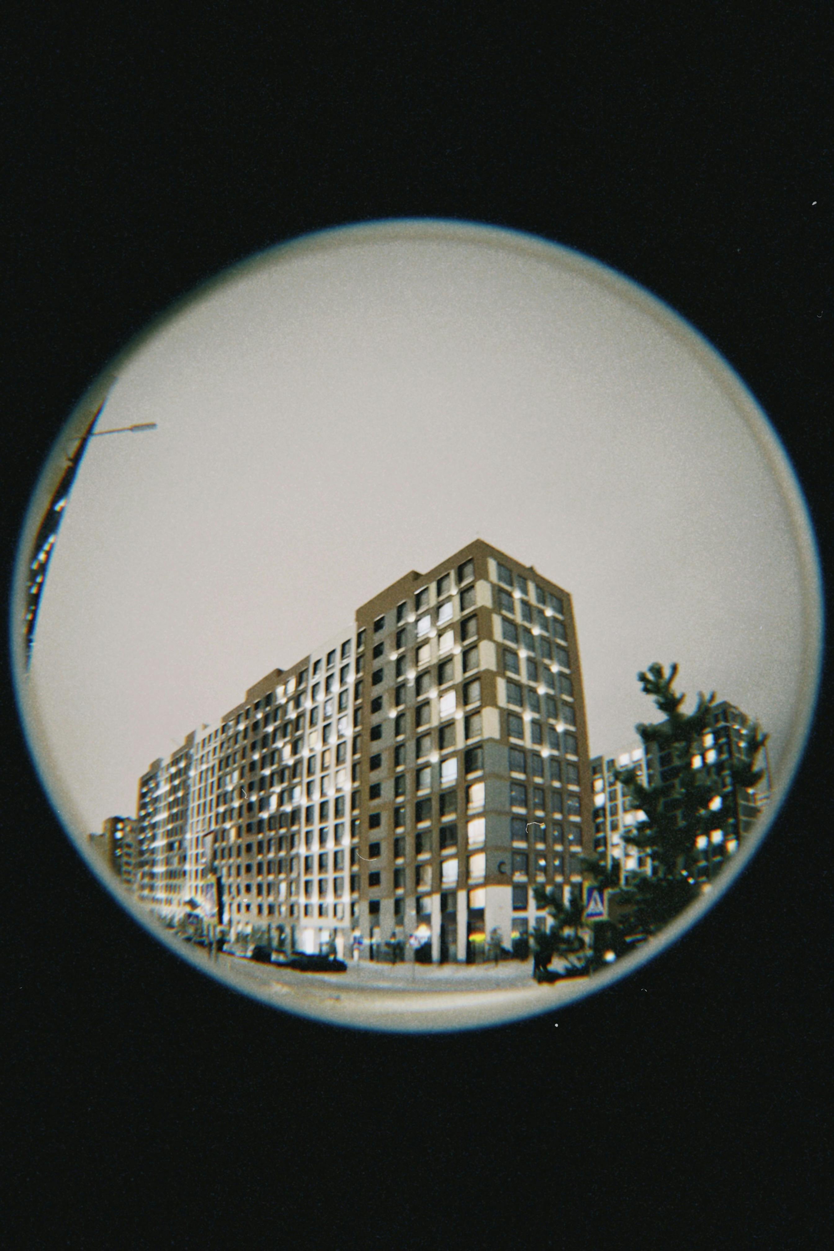 Artistic fisheye lens shot of contemporary high-rise buildings in Astana, Kazakhstan.