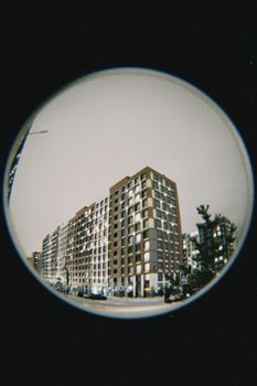 Artistic fisheye lens shot of contemporary high-rise buildings in Astana, Kazakhstan.