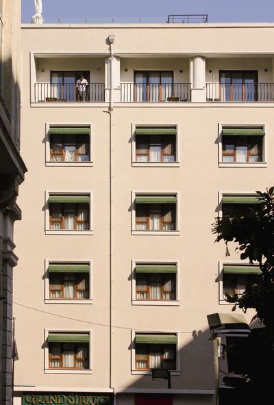 Sunlit hotel facade with balconies and awnings — Esma Çokluk on Pexels