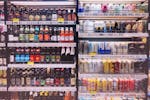 Assorted Bottles and Cans in Commercial Coolers