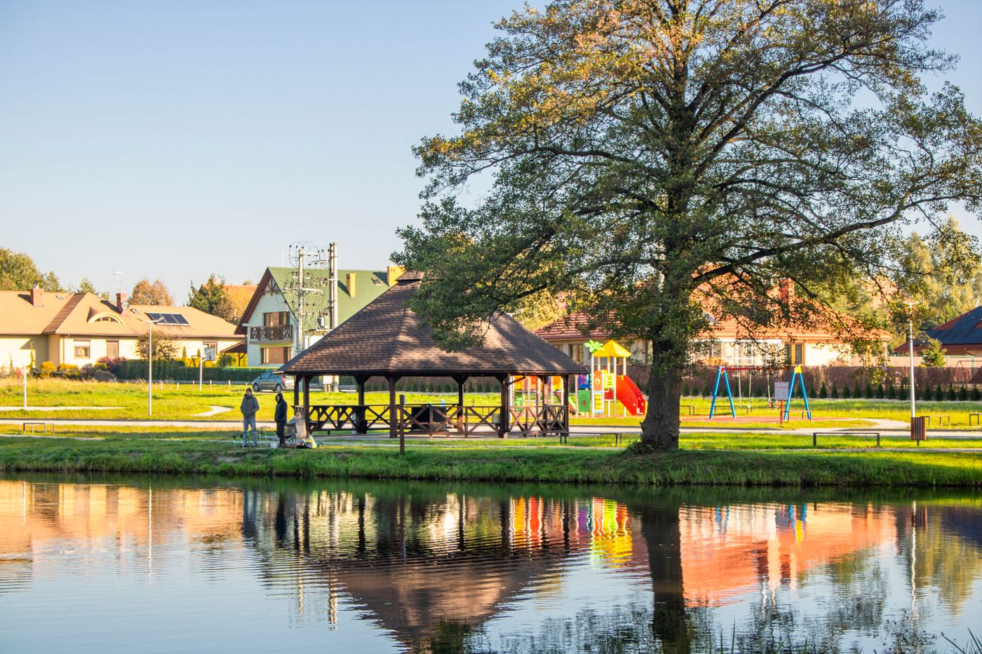 Community pavilion â€” outdoor kitchen, fire pit, gathering space