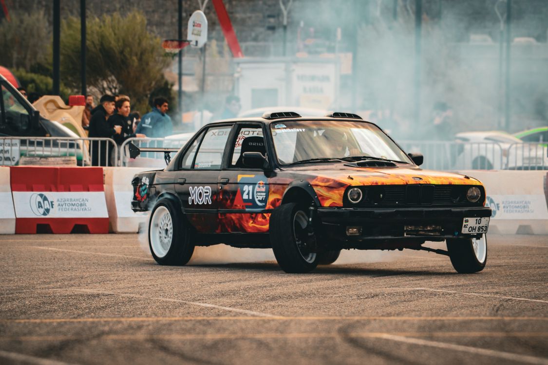 Car Drifting Action at Baku Motorsport Event · Free Stock Photo