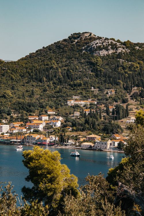 Free Picturesque view of Lopud Island with coastal village and lush greenery in Croatia. Stock Photo