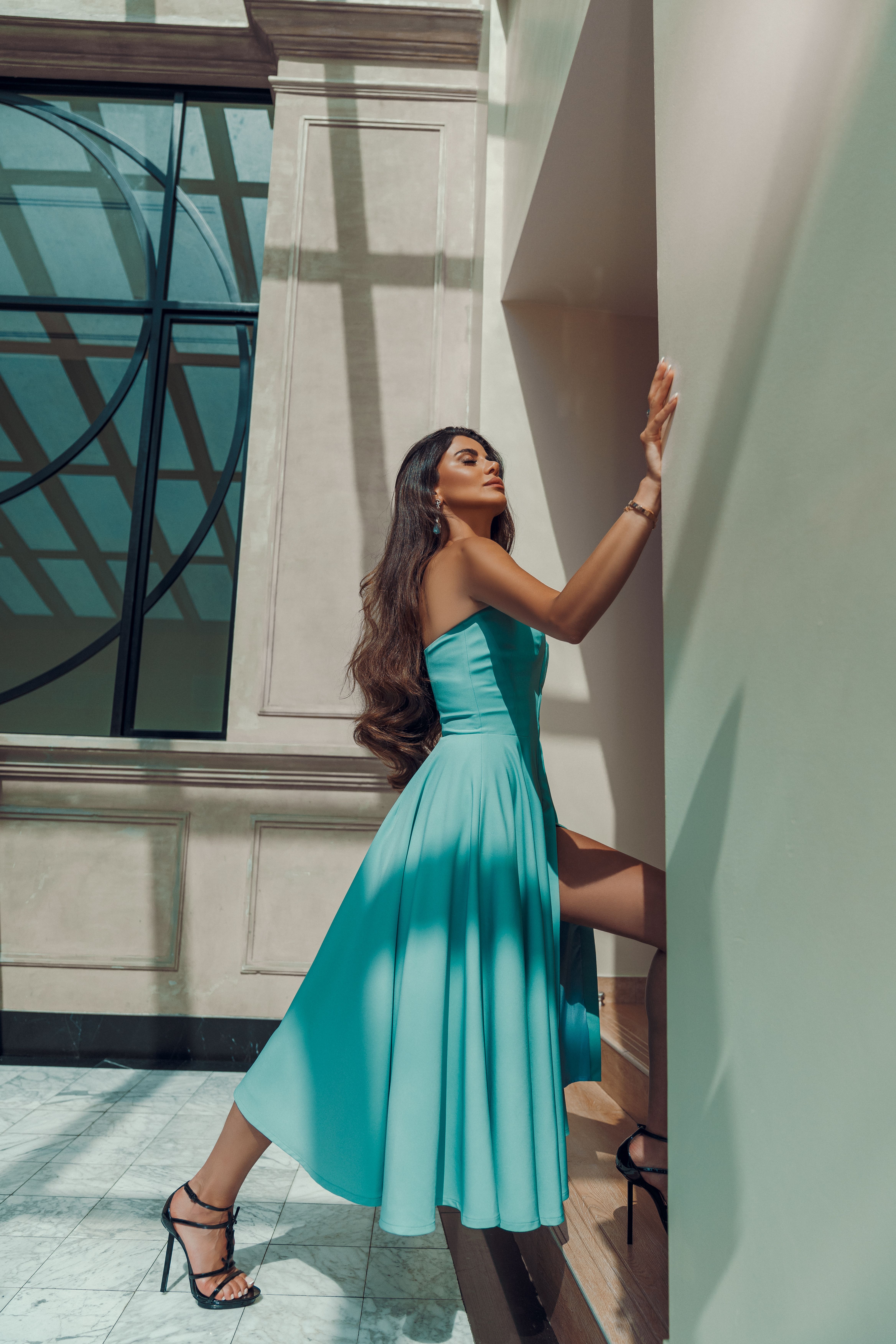 Elegant Woman in Blue Dress Posing Indoors · Free Stock Photo